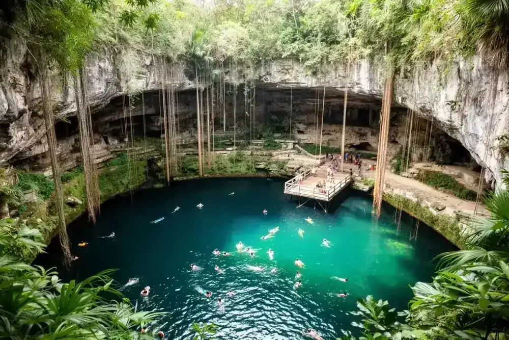 Cenote Ik Kil Mexico with hanging vines and turquoise water near Chichen Itza