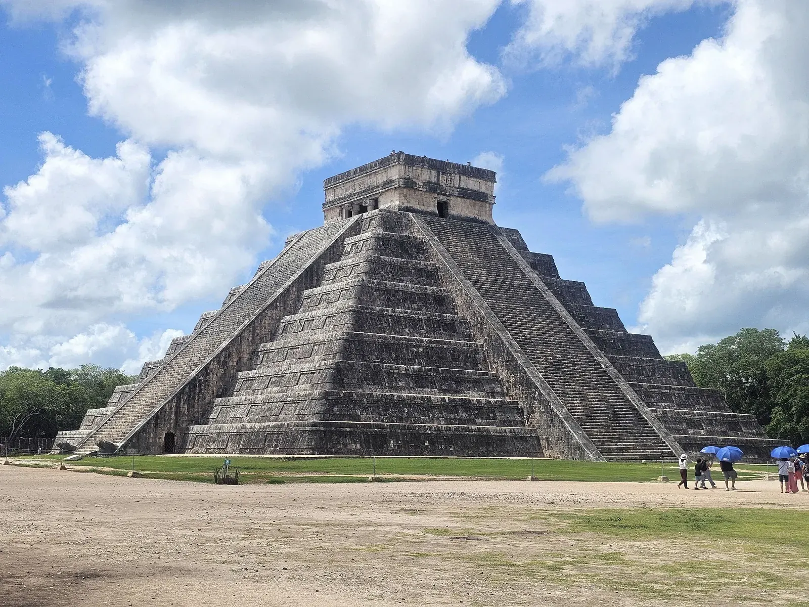 El Castillo pyramid at Chichen Itza under a blue sky in Yucatan, Mexico