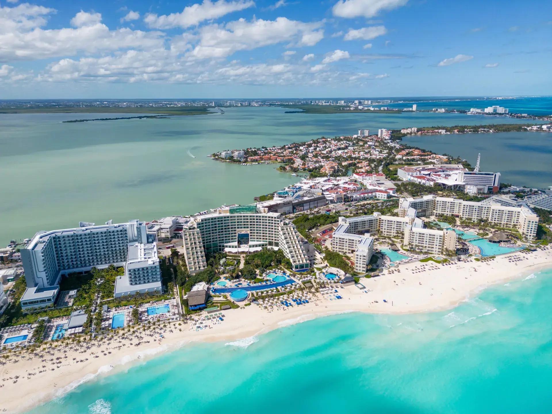 Aerial view of Cancun Hotel Zone resorts and beach with the lagoon behind, Mexico
