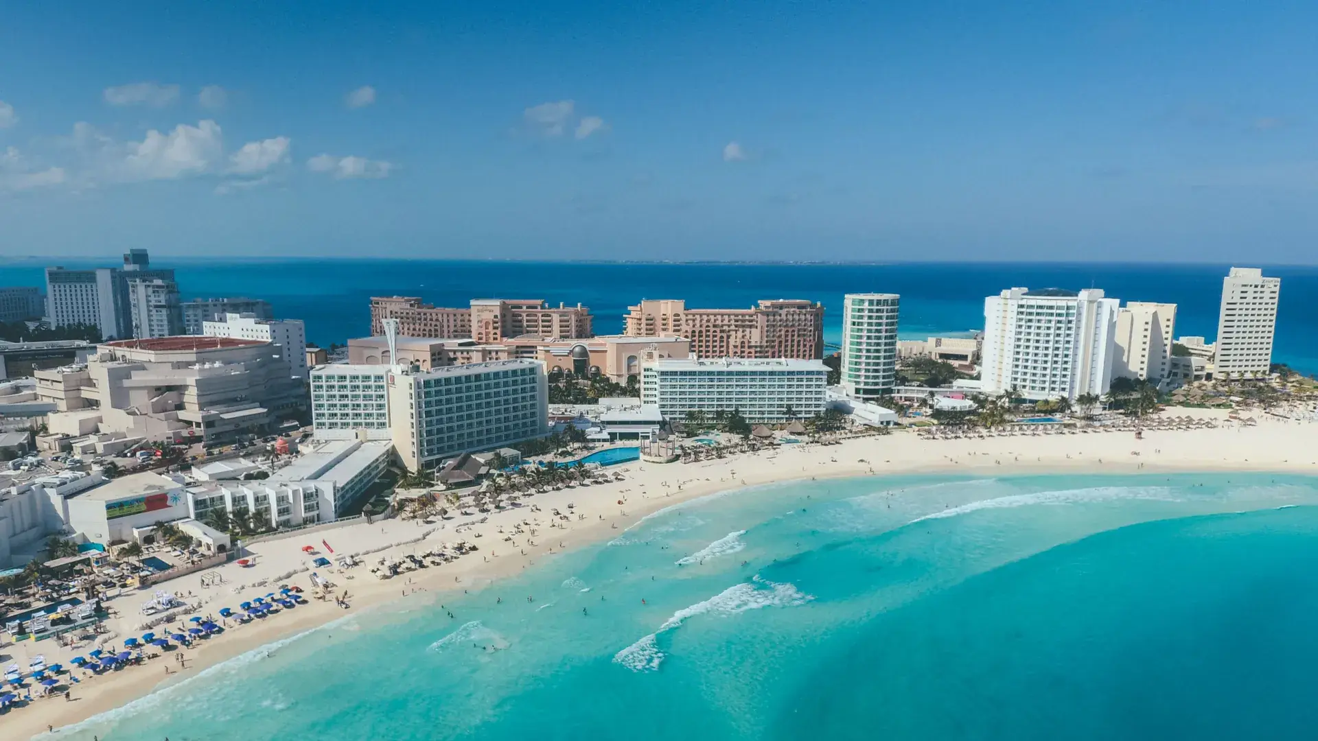 Aerial view of Cancun Hotel Zone white sand beach and resorts along the Caribbean coast, Mexico