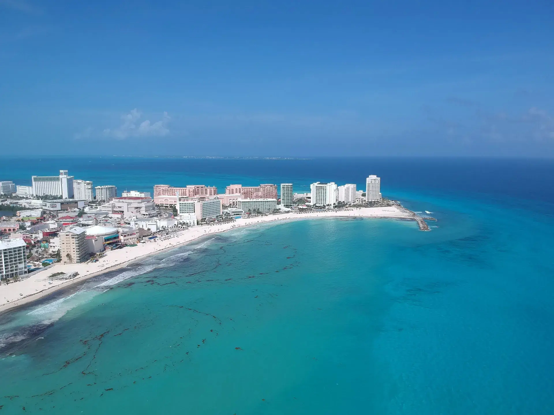 Aerial view of the Punta Cancun peninsula with white sand beach and turquoise water, Cancun Mexico